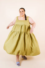 Load image into Gallery viewer, Lady mid-spin wears Celestia tiered dress shows of the voluminous fabric style