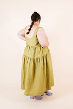 Load image into Gallery viewer, Side view of lady wearing Celestia dress shows gathered tiers detail