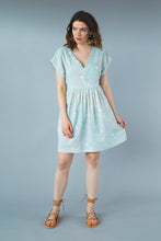 Load image into Gallery viewer, Lady wears a short kaftan dress with gathered waist seam