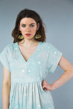 Load image into Gallery viewer, Close up bodice view shows a V-neck top with a gathered skirt waistline seam