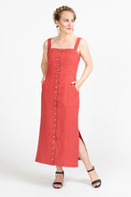 Load image into Gallery viewer, Front view of lady wearing Fiona Sundress with hands in front waist pockets