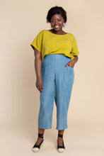 Load image into Gallery viewer, Lady wears a tapered Pietra trousers with hand in pocket
