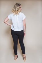 Load image into Gallery viewer, Back view of cropped Kalle shirt with rounded hems