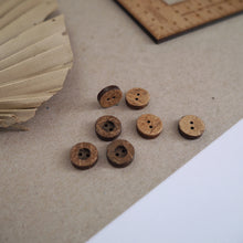 Load image into Gallery viewer, 12mm, 2-hole coconut buttons scattered across worktop