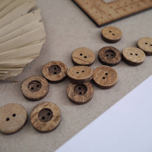 Load image into Gallery viewer, 20mm, 2-hole coconut buttons scattered across worktop