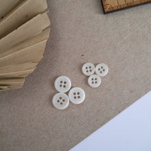 Load image into Gallery viewer, Three 11m buttons next to three 8mm 4-hole Corozo buttons