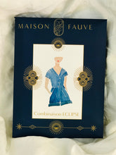 Load image into Gallery viewer, Package showing watercolour painting of the playsuit in blue.