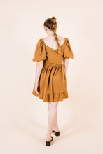 Load image into Gallery viewer, Back view of knee-length Estella Dress with cross over across back
