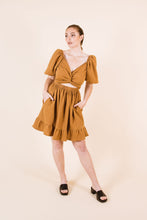 Load image into Gallery viewer, Front view of knee-length Estella dress, with an interlinked cross-over front