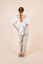 Load image into Gallery viewer, Back view of cropped top with large ties tied into a bow tie across back