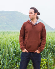 Load image into Gallery viewer, Man wears a brown hooded sweater with kangaroo pocket.