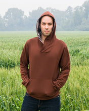 Load image into Gallery viewer, Man wears Finlayson sweater with the hood up, hands in the kangaroo pocket.
