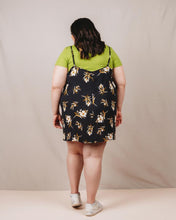 Load image into Gallery viewer, Back view of lady wearing above-knee length Saltwater Slip dress layered over a tee