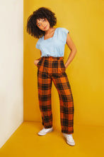 Load image into Gallery viewer, Lady poses with hands in pockets, wearing a Square Neck top tucked into trousers