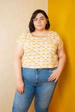 Load image into Gallery viewer, Lady stands wearing a Square Neck top which sits above waistline of jeans