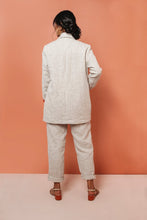 Load image into Gallery viewer, Back view of lady wearing Heather Blazer with trousers.