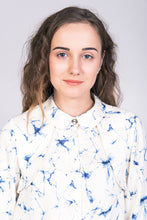 Load image into Gallery viewer, Close up of lady wearing a blouse with cape detail at shoulders.