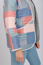 Load image into Gallery viewer, Close up view of deep slanted pocket of Hovea Jacket with bound edging detail
