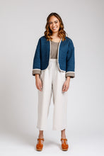 Load image into Gallery viewer, Lady wears a cropped Hovea Jacket with contrasting colour cuffs. Three-quarter length sleeves