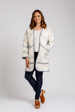 Load image into Gallery viewer, Lady wears mid-thigh length quilted Hovea jacket