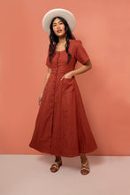 Load image into Gallery viewer, Lady wears Hughes Dress with hand in pocket. Ankle length flare skirt.