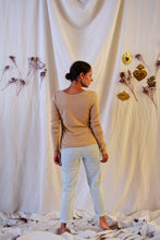 Load image into Gallery viewer, Back view of lady standing, wearing Hussard jeans showing rolled up hems.