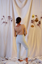 Load image into Gallery viewer, Back view of lady standing, wearing Hussard jeans showing pocket detail