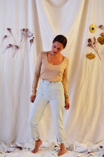 Load image into Gallery viewer, Front view of lady, wearing Hussard jeans showing pleating detail at waist.