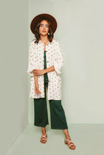 Load image into Gallery viewer, Lady stands wearing knee-length Ilford jacket, folding up sleeves