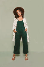 Load image into Gallery viewer, Lady stands wearing knee-length Ilford jacket, with both hands tucked into undergarment pockets.