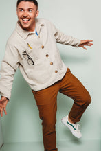 Load image into Gallery viewer, Male poses, balancing on one leg wearing Ilford jacket fastened up, with spectacles and pencil protruding from chest pocket.