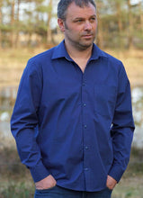Load image into Gallery viewer, Man wears Jensen shirt with pointed collar and one chest pocket in bold blue fabric.