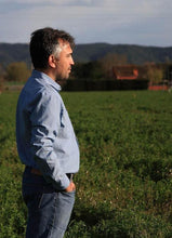 Load image into Gallery viewer, Side view of man wearing classic Jensen shirt with pointed collar, and chest pocket. Worn with hem tucked into trousers.