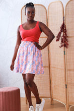 Load image into Gallery viewer, Lady wears a vest top paired with a short skirt made with the Nenuphar Viscose fabric