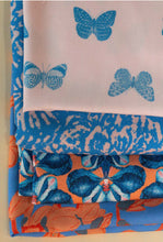 Load image into Gallery viewer, Four different designs of EcoVero fabric folded on top of one another