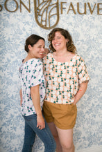 Load image into Gallery viewer, Two ladies hugging, both wearing a patterned Palma top worn untucked