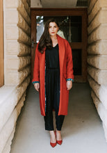 Load image into Gallery viewer, Lady stands wearing an opened Pam coat showing contrasting lining fabric