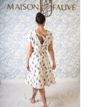 Load image into Gallery viewer, Lady wears Byzance Dress shows back view of deep V neck