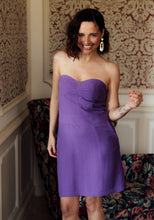 Load image into Gallery viewer, Lady wears a bustier dress above the knee length, strapless