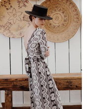 Load image into Gallery viewer, Lady stands on a side view with arms crossed wearing a Sierra Top, shows deep back V neck, and wide tie waist belt