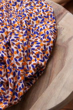 Load image into Gallery viewer, Mandarine EcoVero fabric slightly crumpled on table
