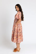 Load image into Gallery viewer, Side view of lady wearing Protea dress with hand in pocket