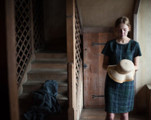 Load image into Gallery viewer, Lady holds a hat wearing a Camber T-shirt dress in check fabric
