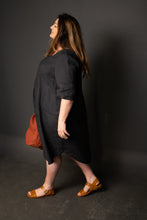Load image into Gallery viewer, Side view of Lady wearing a knee length Dress Shirt