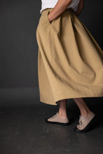 Load image into Gallery viewer, Side view of lady with hand in pocket as she walks wearing the Shepherd Skirt