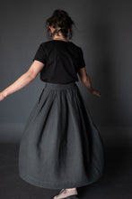Load image into Gallery viewer, Back view of lady wearing Shepherd Skirt as she twirls around