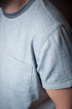 Load image into Gallery viewer, Close up of sleeve detail with small turn up. Also showing chest patch pocket