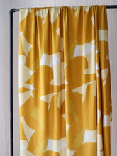 Load image into Gallery viewer, EcoVero Viscose hangs on rail shows off fluid drape with bold print