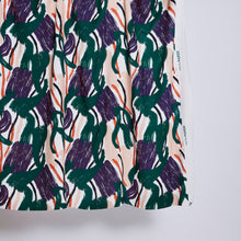Load image into Gallery viewer, Bottom corner of EcoVero Viscose Line fabric hangs shows abstract print