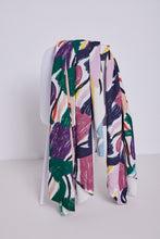 Load image into Gallery viewer, Ivy Brush Viscose Linen fabrics in different colourways bunched together, draped over a chair